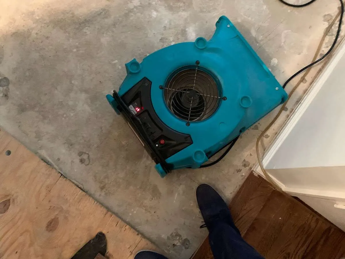 Air mover drying subfloor during Leak Detection & Repair in Summit View